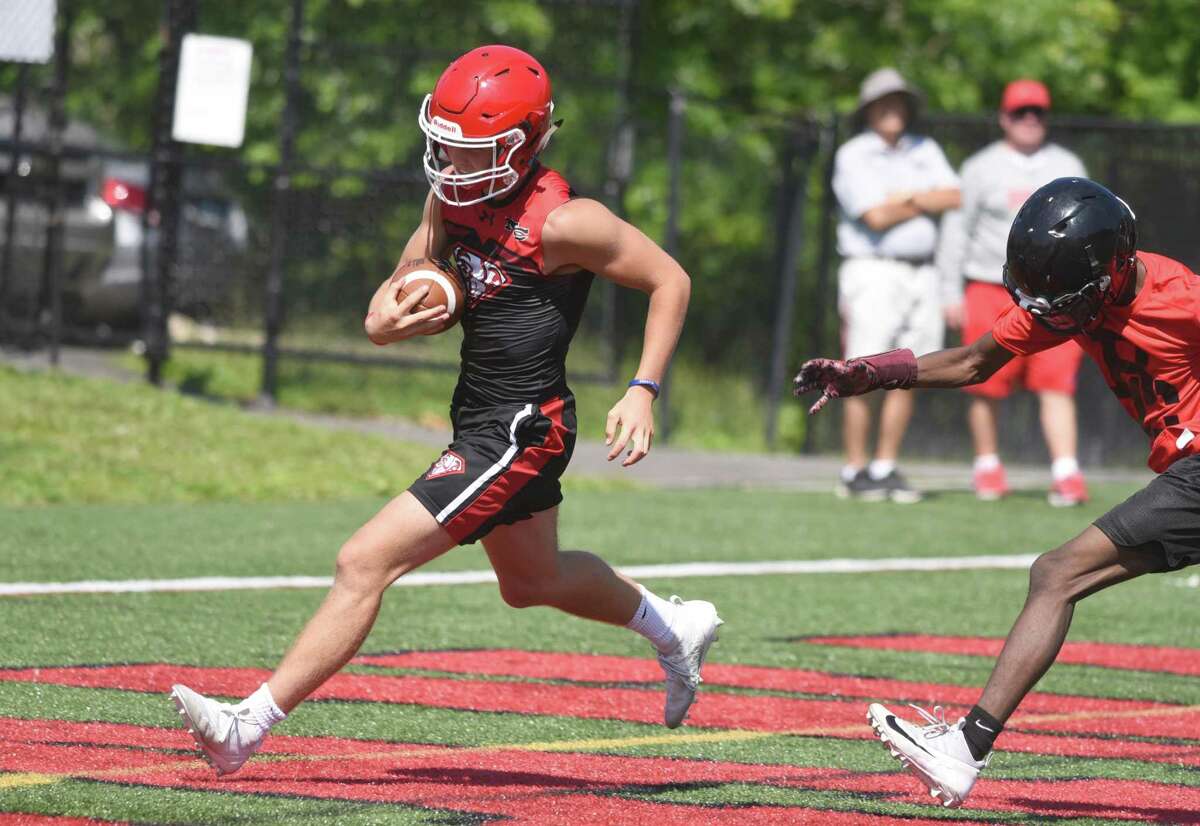 New Canaan’s Drew Guida scores a touchdown during the annual Grip It and Rip It football tournament in New Canaan on Friday, July 12, 2019.