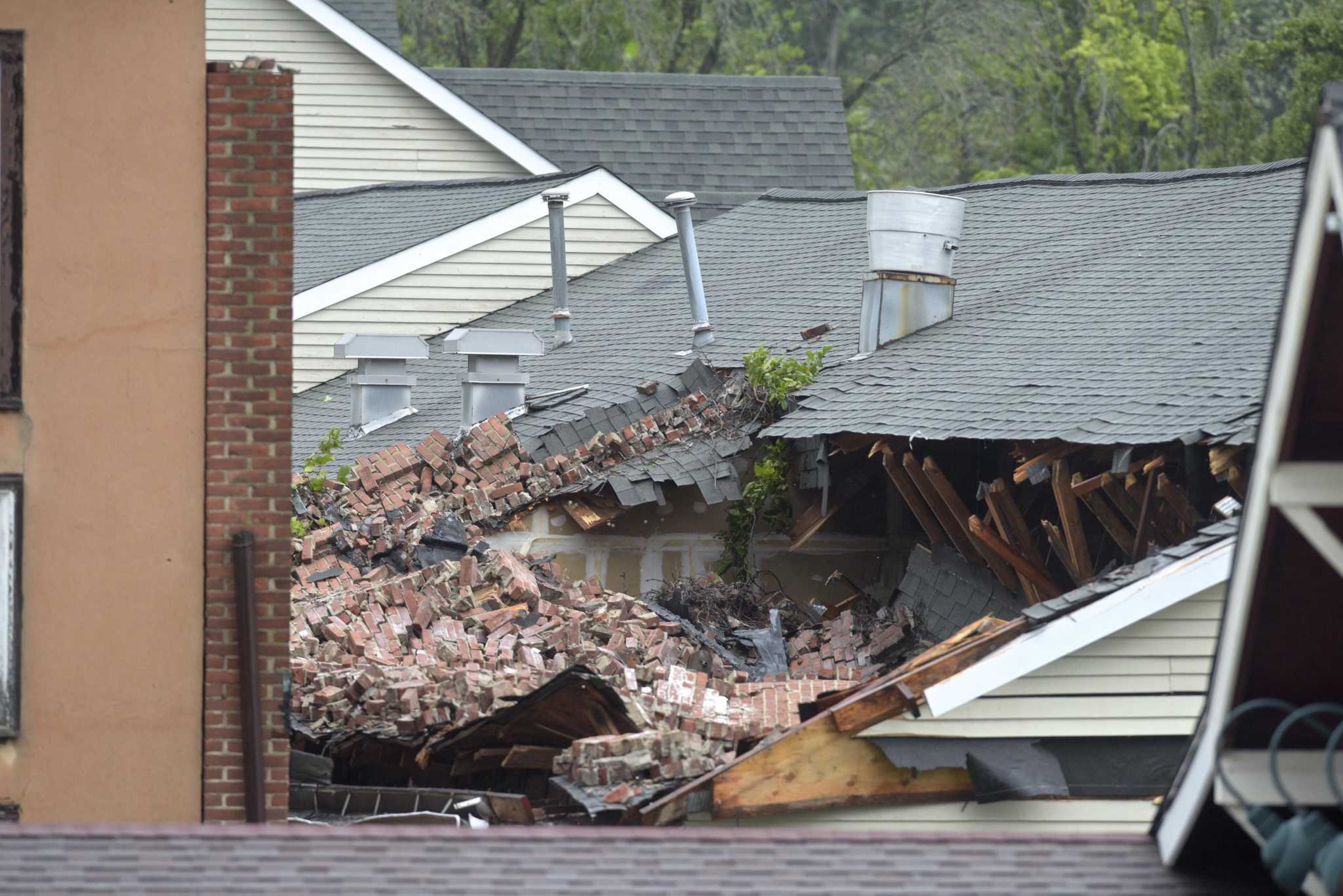 ‘Widespread disaster’ Damage, power outages after Tropical Storm slams