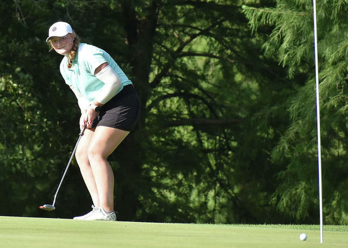 East Alton’s Gracie Piar watches her putt roll to the cup for an eagle on the par 5, hole No. 11 on Tuesday at the 41st Illinois State Junior Girls Championship at Hickory Point Golf Course in Forsyth. Piar, who will be a junior at Marquette Catholic, shot 1-under par 71 to sit in a tie for fourth place halfway through the 36-hole tournament.