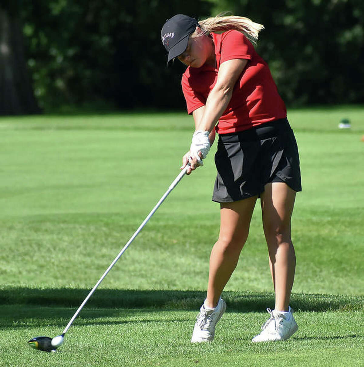 Godfrey’s Audrey Cain, an incoming junior at Marquette Catholic, hits her drive at hole No. 12 Tuesday in the Illinois State Junior Girls Championship at Hickory Point Golf Course in Forsyth. Cain shot 86 and is tied for 60th place after day one of the two-day tourney.