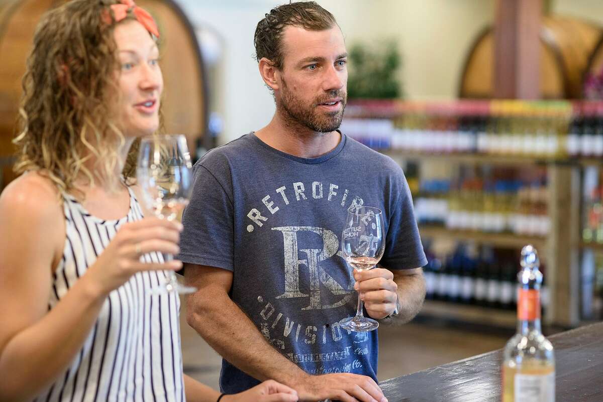 Jacob Jenkinson and Kate Maxwell, visiting from Australia, taste wines at Sutter Home's tasting room in St Helena, Calif., on Friday July 20, 2018.