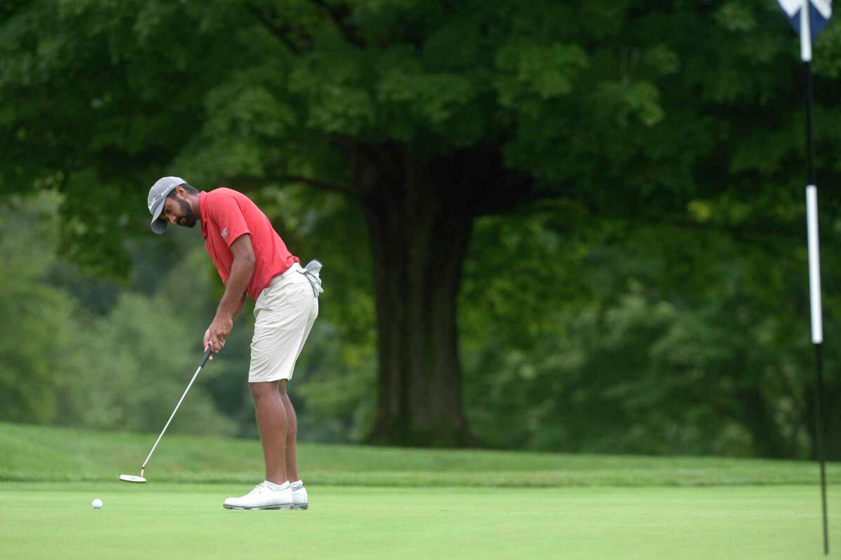 Saptak Talwar, from Great River Golf Course, putts on the 4th hole in the second round of the Connecticut Open tournament at Ridgewood CC in Danbury on Tuesday.
