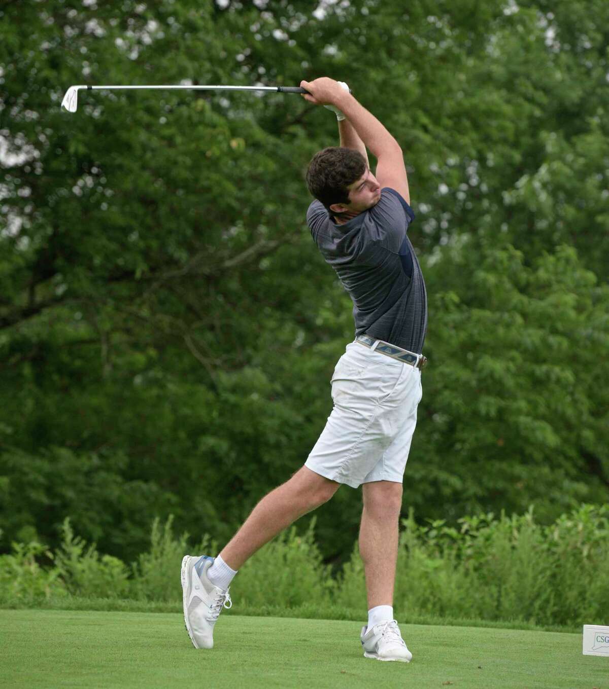 Christopher Ayers, from Goodwin Park Golf Course, hits from the 4th tee in the second round of the Connecticut Open tournament at Ridgewood CC in Danbury on Tuesday.