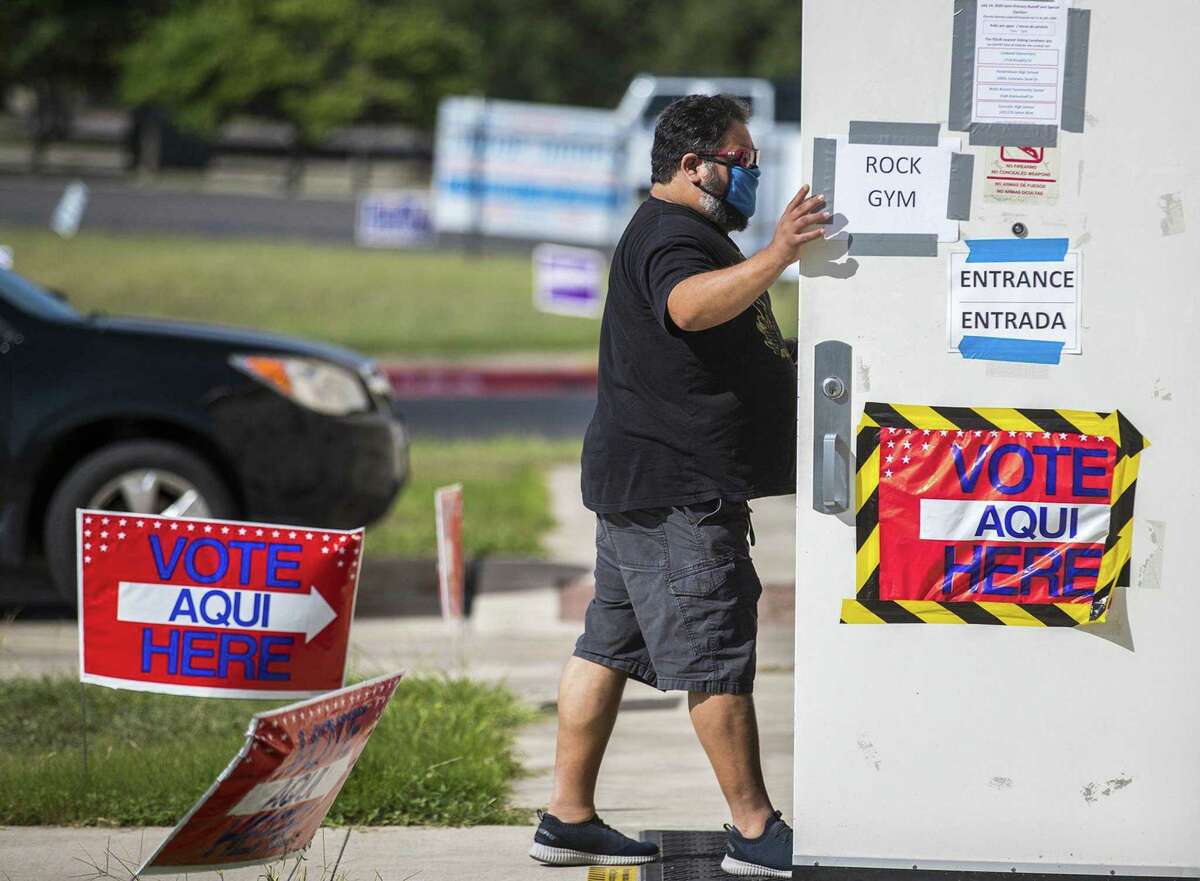 Voter Ed Martinez make his way to vote at Pflugerville ISD Rock Gym in the Election Day Primary Runoff on Tuesday , July 14, 2020. (Ricardo B. Brazziell/Austin American-Statesman/TNS)