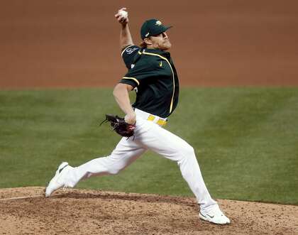 Oakland Athletics' Jake Diekman pitches in 7th inning against San Francisco Giants during exhibition game at Oakland Coliseum in Oakland, Calif., on Monday, July 20, 2020.