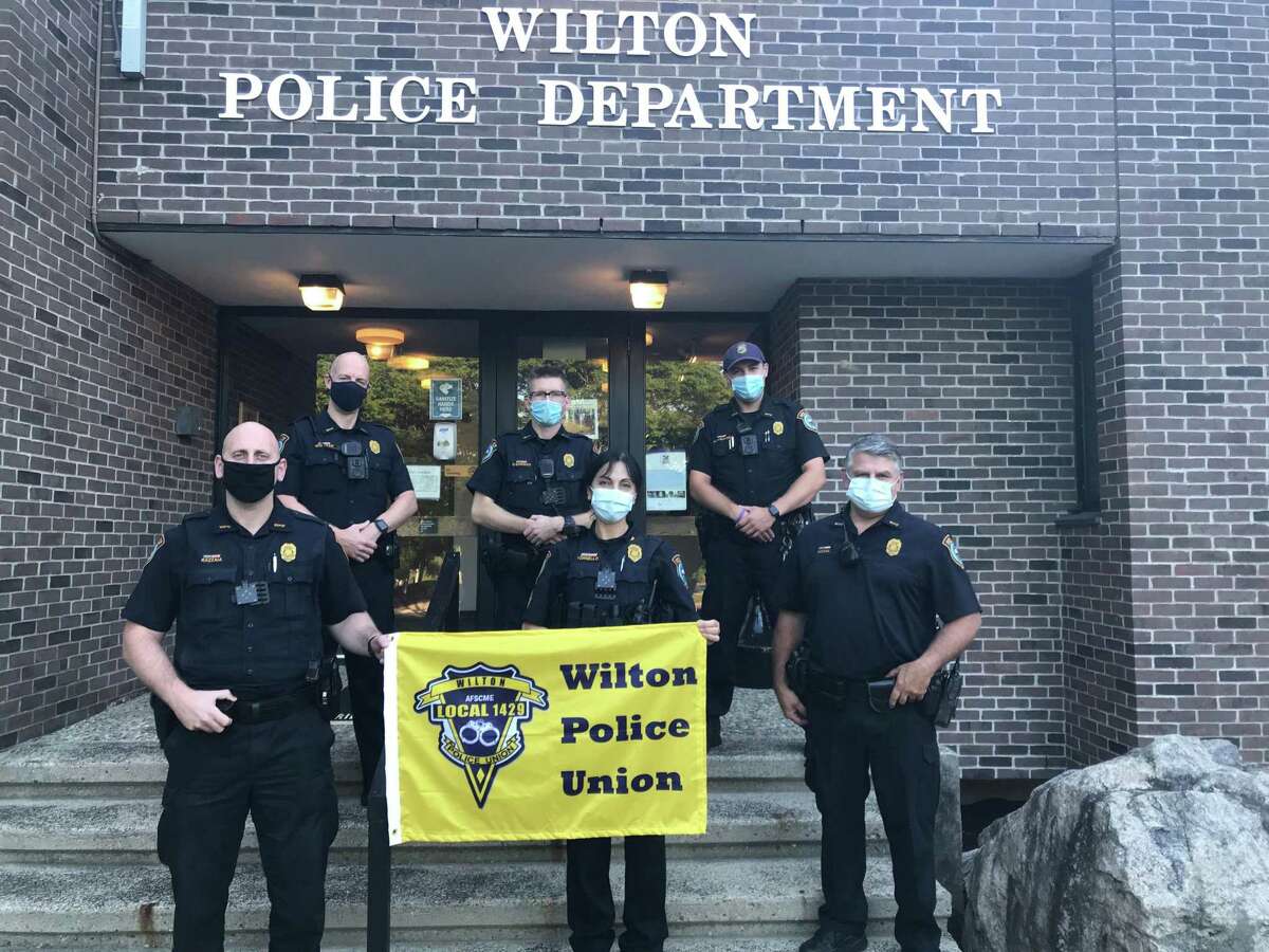 Several members of the Wilton Police Union stand in front of the police station. Back row from left, William Whitman (new recruit), Ofc. Graham O’Connor, Ofc. Sean Baranowski. Front row from left, Ofc. Frank Razzaia (union vice president), Sgt. Anna Tornello (union president), and Ofc. Robert Nosal.