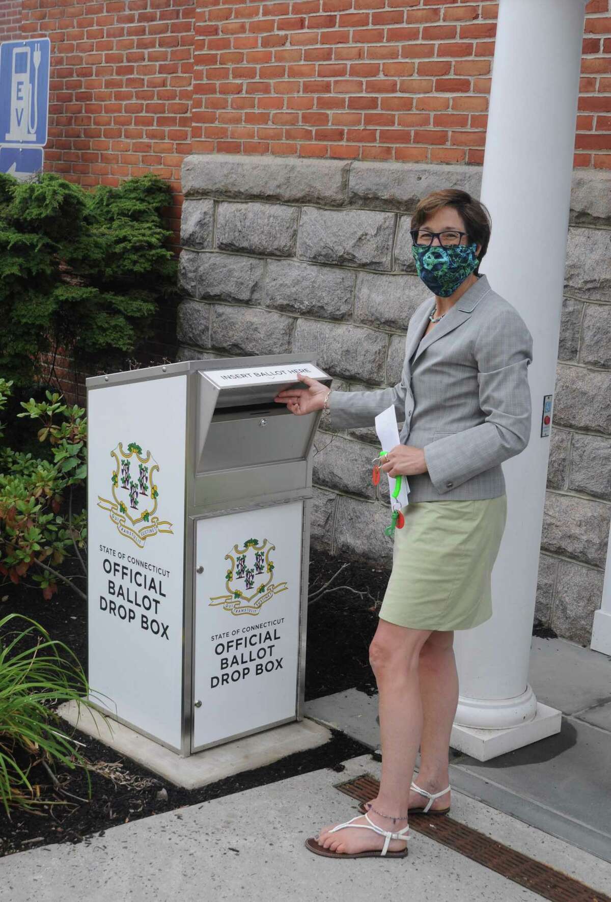 Town Clerk Wendy Lionetti advises voters to use the official ballot drop box by the Bailey Avenue entrance to town hall, rather than mail back absentee ballots and risk having them come in too late.