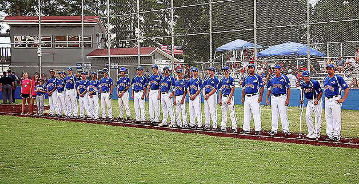 Stamford players and coaches line up for the start of the Babe Ruth World Series game at Burlington Field in Monticello, Arkansa on Sunday August 22, 2010. The game went into a rian delay before the first pitch was thrown.