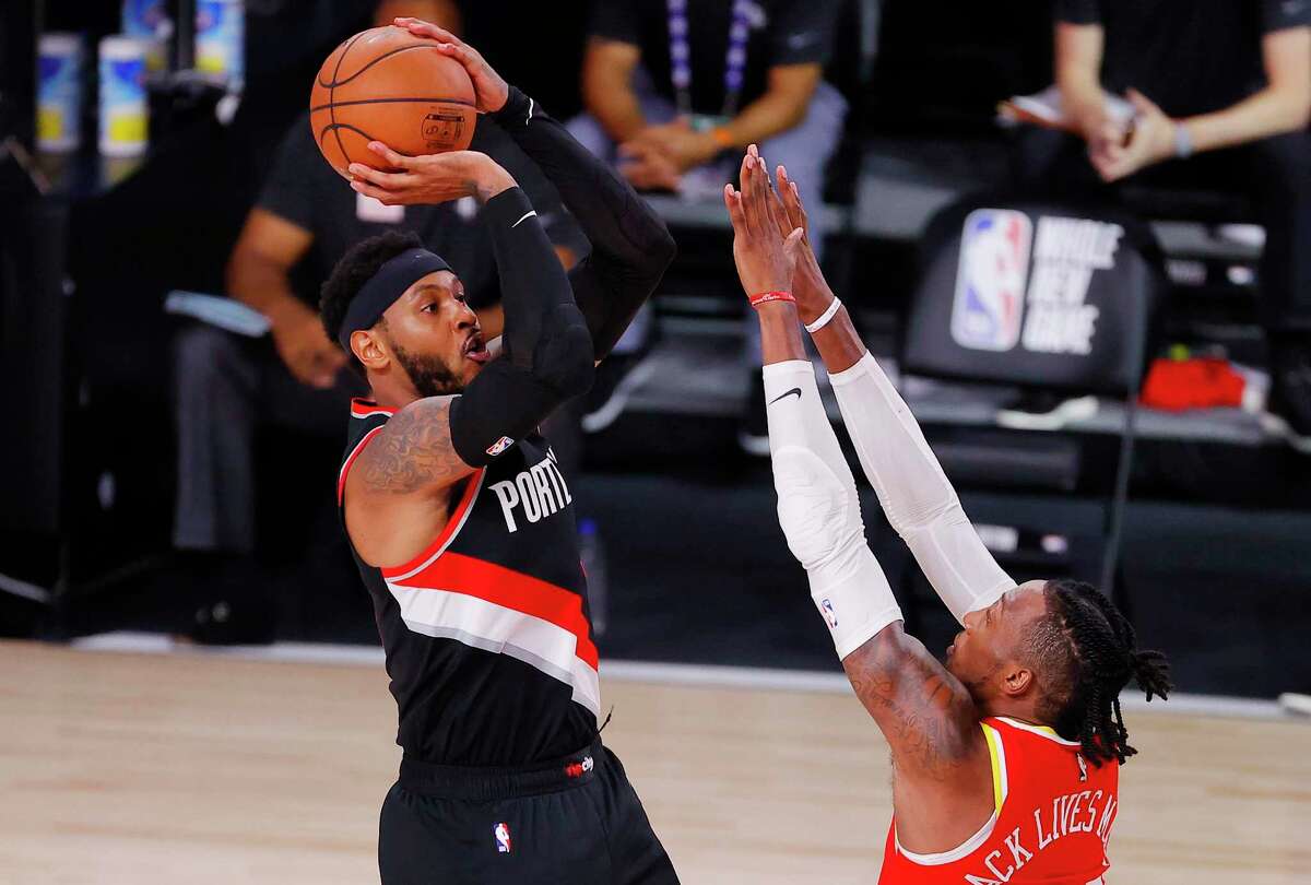 Carmelo Anthony, shooting over the Rockets Robert Covington, has found a fit and a role in Portland that he couldn’t during his short stay in Houston.