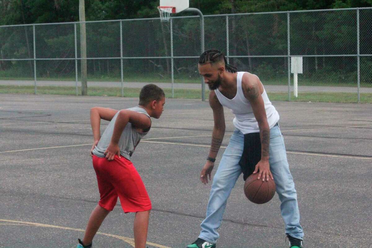 Former Baldwin standout Scotty Abscomb (right) goes one-on-one against his brother Cash Abscomb on Saturday at Hollister Park. (Star photo/John Raffel)