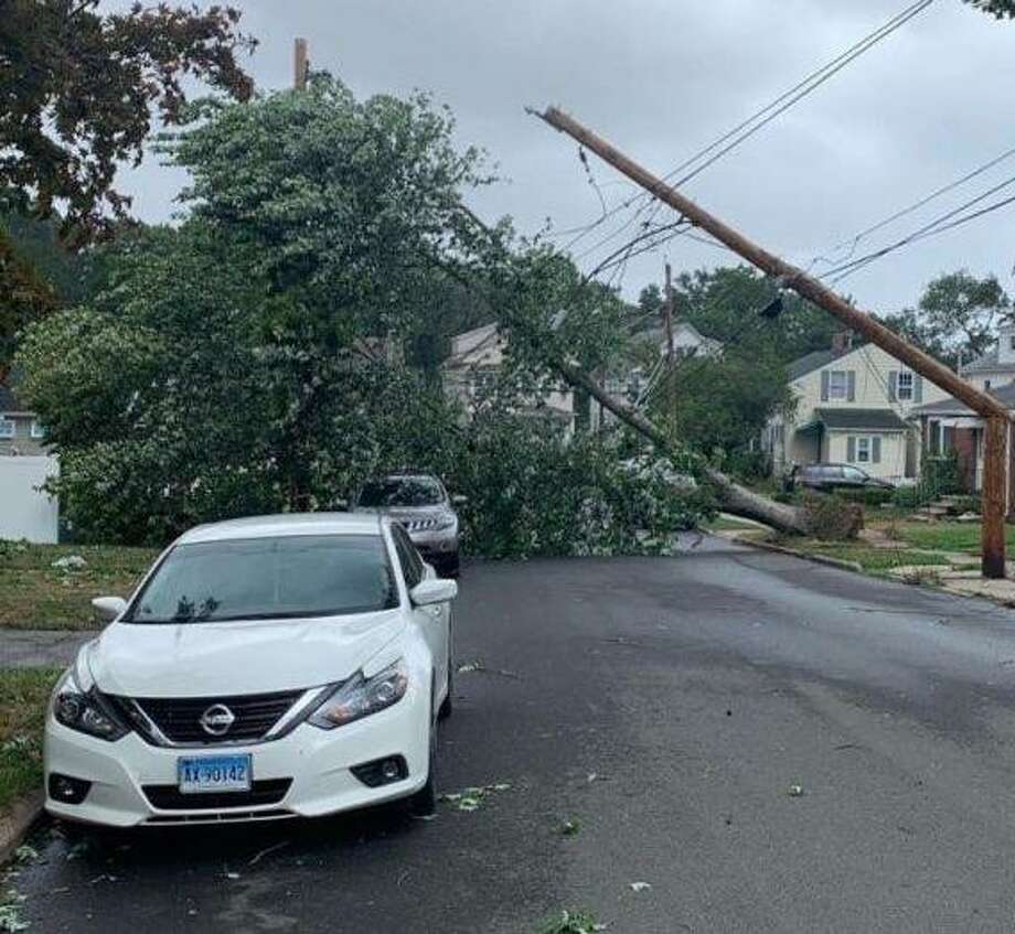 A fallen tree brought down power lines and damaged a transformer on Dwight Place in East Haven, cutting power to residents of the five-unit Cornerstone Walk condominium complex. As of Thursday morning, they were still without power. Photo: Elaine Charpentier / Contributed Photo