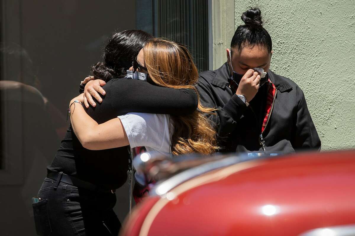 Friends and family of Sean Monterrosa embrace during Monterrosa�s funeral service at the Chapel by the Sea on Friday, June 19, 2020, in Pacifica, Calif. Monterrosa was killed by a Vallejo police officer. Vallejo police chief Shawny Williams said Monterrosa, 22, appeared to be running toward a suspect vehicle just after 12:30 a.m. last Tuesday when he suddenly dropped to his knees and brought his hands above his waist, revealing what an officer mistook for the butt of a firearm. The officer, who was in a vehicle, unloaded five shots through his windshield, striking Monterrosa. The object the officer saw tucked into Monterrosa�s sweatshirt pocket was actually a 15-inch hammer, Williams said.