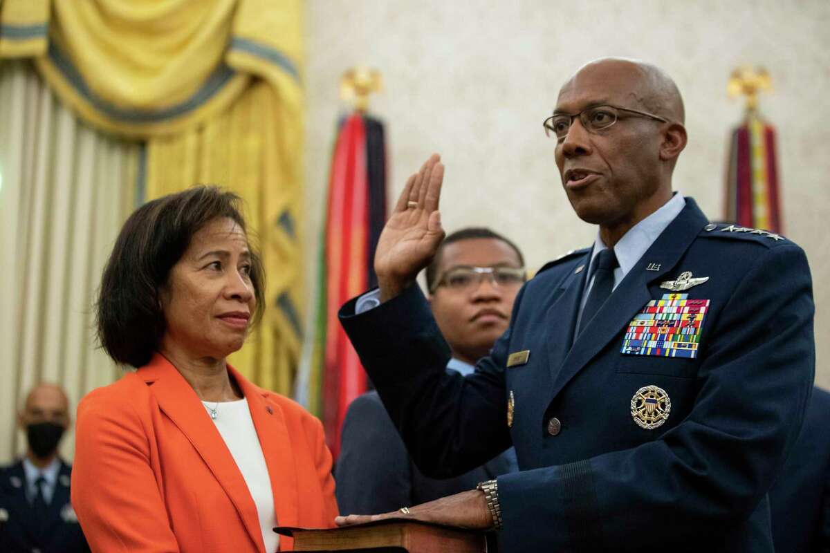 Gen. Charles Q. Brown Jr., was sworn in Tuesday at the Oval Office as chief of staff of the Air Force as his wife Sharene Guilford Brown, holds a bible. His installation ceremony was Thursday.