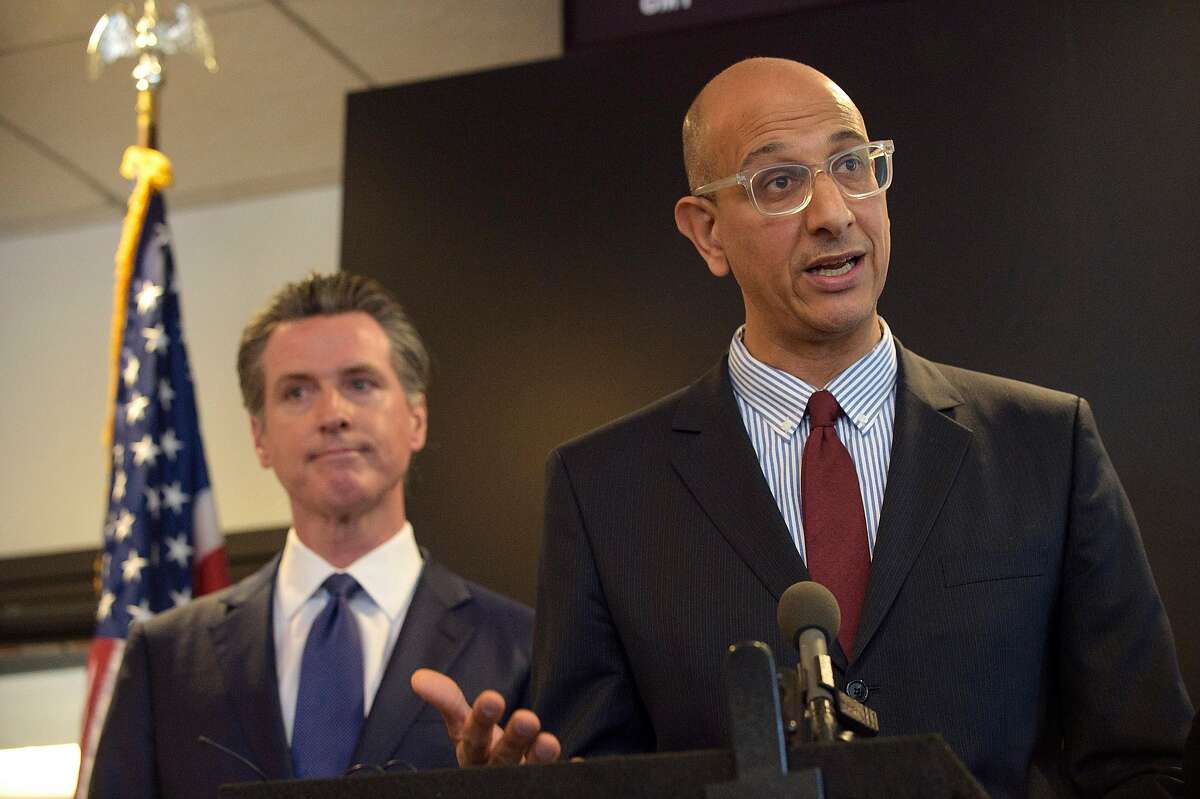 Mark Ghaly, California’s Health and Human Services Agency secretary, right, at a Feb. 27 news conference in Sacramento with Gov. Gavin Newsom.
