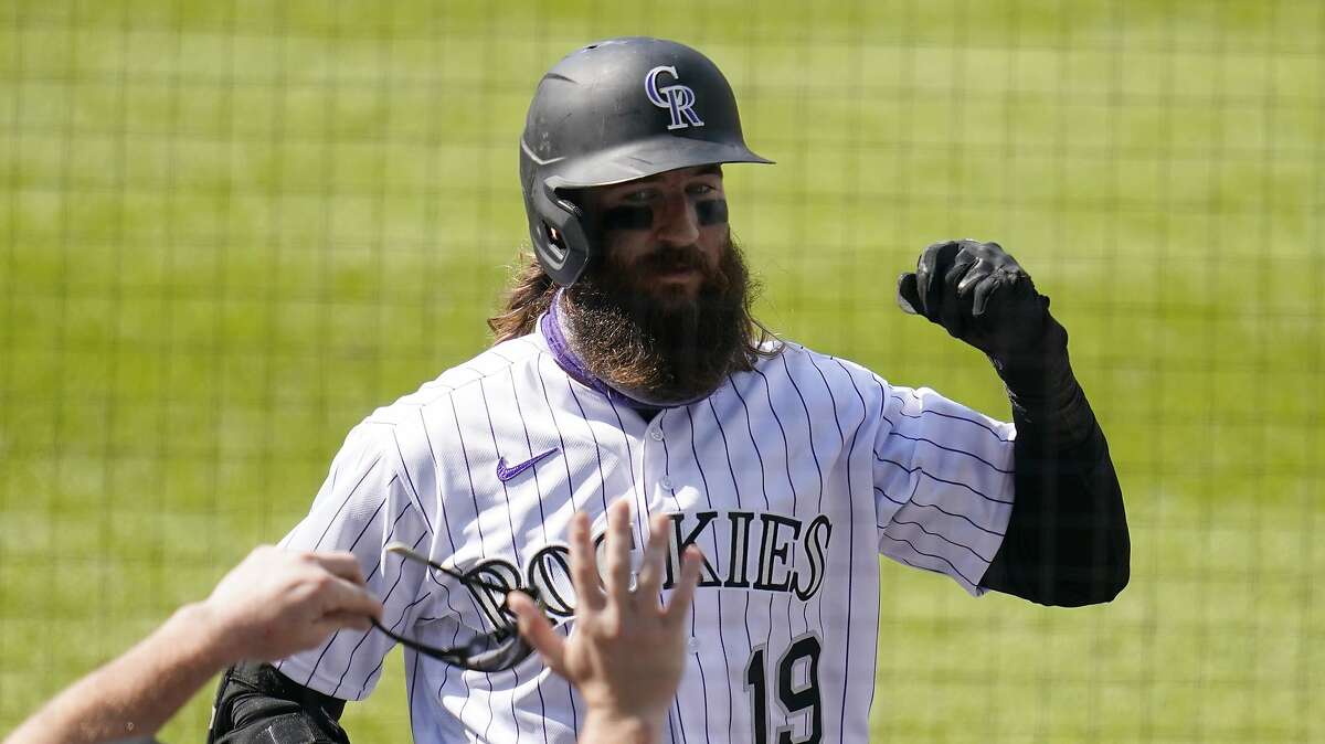 Colorado Rockies' Charlie Blackmon celebrates a three run home run against the San Francisco Giants during the seventh inning of a baseball game, Thursday, Aug. 6, 2020, in Denver. (AP Photo/Jack Dempsey)