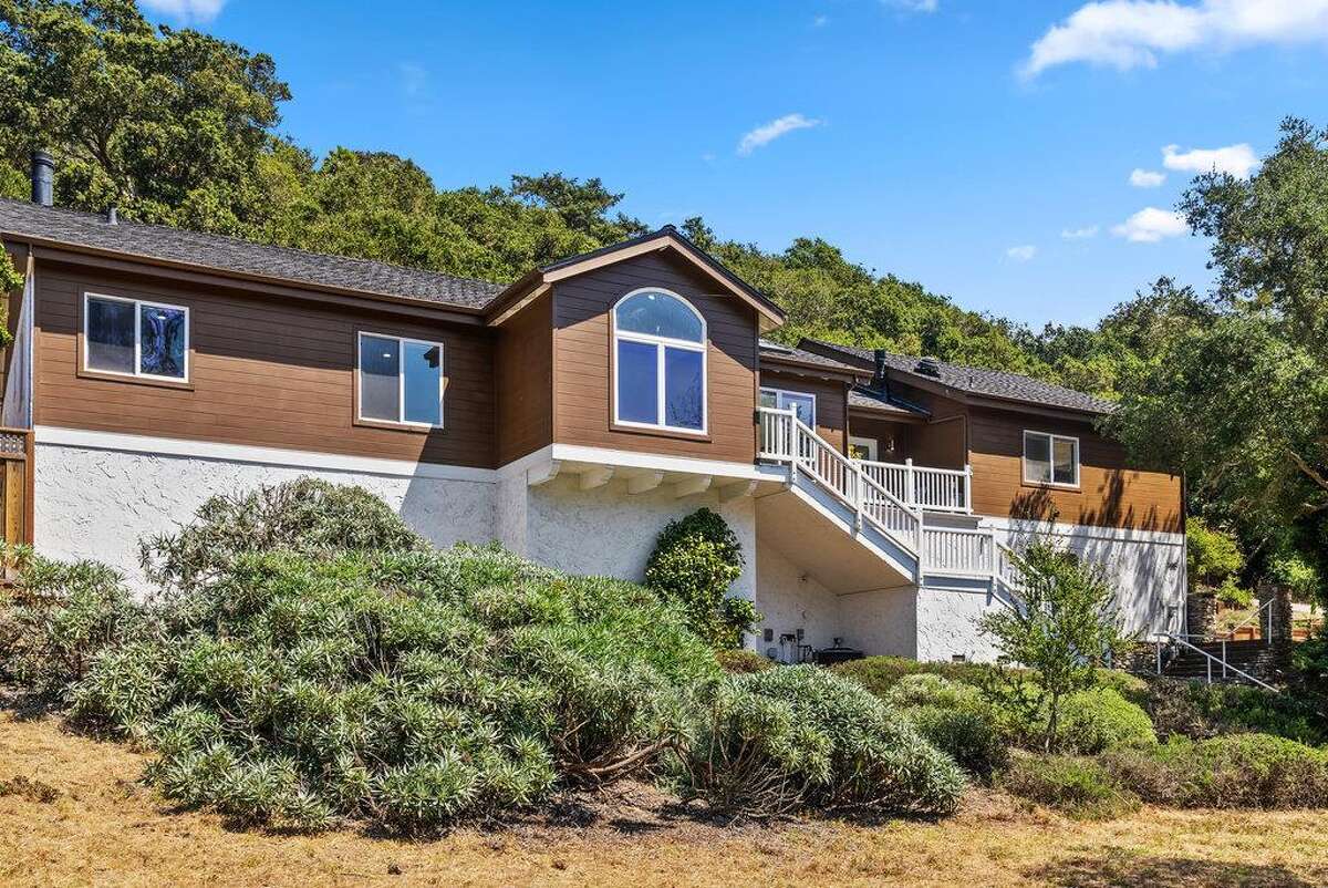 65 Dipsea Road. Stinson Beach, CA PRICE: $4,800,000 DESCRIPTION: Dip into the calm sublime of the maritime... Situated on the widest stretch of the Seadrift lagoon with beautiful views of the lagoon and Mount Tamalpais, this Dipsea darling is surrounded by natural beauty. A short walk to downtown Stinson Beach and a stunning, 40 minute drive to the Golden Gate, you can't ask for a better location for your vacation home. Brimming with natural light and water views from every room, you’ll settle quickly into the calmness and joy this darling home emanates. The spacious two bedroom, two bathroom home has much to offer, with plenty of storage for all the fun toys that come with beach life; surfboards hanging in the garage, beach cruisers ready to ride, and kayaks and standup paddleboards stowed away on the lower dock — where you can plunge right into the Seadrift lagoon. Life at the beach doesn't get any better than this. Within the Seadrift community, you are rooted in coastal comfort with easy access to the bird sanctuary on the Bolinas lagoon, the coveted Seadrift beach with great surf and beautiful views, tennis and pickleball courts, and easy access to the Tamalpais trails. This Dipsea darling is a home for making memories to be cherished forever. Specifications: ? Spacious 2 bedroom 2 full bath ? 1859 square footage house ? 7500 square footage lot ? Primary bedroom with grand en suite bathroom ? Second bedroom and second full bathroom separated by the main living space ? Den area ? Kitchen island and open concept living area with fireplace ? Dining room ? Wraparound back deck and lower dock ? Hot tub ? Lower storage...