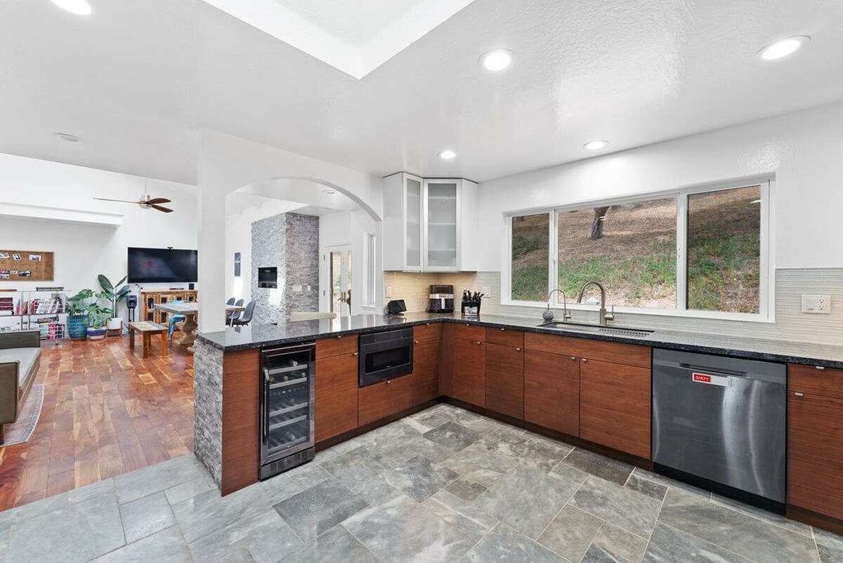 65 Dipsea Road. Stinson Beach, CA PRICE: $4,800,000 DESCRIPTION: Dip into the calm sublime of the maritime... Situated on the widest stretch of the Seadrift lagoon with beautiful views of the lagoon and Mount Tamalpais, this Dipsea darling is surrounded by natural beauty. A short walk to downtown Stinson Beach and a stunning, 40 minute drive to the Golden Gate, you can't ask for a better location for your vacation home. Brimming with natural light and water views from every room, you’ll settle quickly into the calmness and joy this darling home emanates. The spacious two bedroom, two bathroom home has much to offer, with plenty of storage for all the fun toys that come with beach life; surfboards hanging in the garage, beach cruisers ready to ride, and kayaks and standup paddleboards stowed away on the lower dock — where you can plunge right into the Seadrift lagoon. Life at the beach doesn't get any better than this. Within the Seadrift community, you are rooted in coastal comfort with easy access to the bird sanctuary on the Bolinas lagoon, the coveted Seadrift beach with great surf and beautiful views, tennis and pickleball courts, and easy access to the Tamalpais trails. This Dipsea darling is a home for making memories to be cherished forever. Specifications: ? Spacious 2 bedroom 2 full bath ? 1859 square footage house ? 7500 square footage lot ? Primary bedroom with grand en suite bathroom ? Second bedroom and second full bathroom separated by the main living space ? Den area ? Kitchen island and open concept living area with fireplace ? Dining room ? Wraparound back deck and lower dock ? Hot tub ? Lower storage...