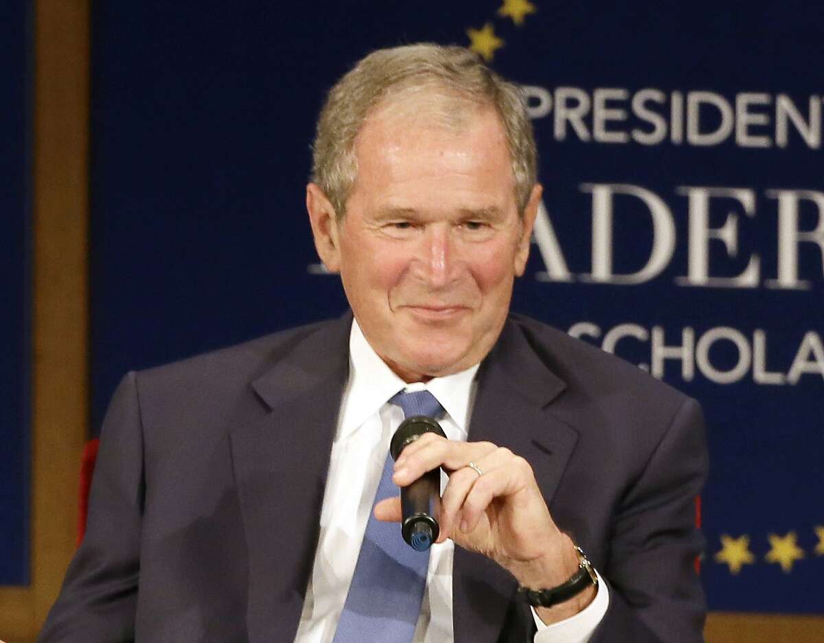 FILE - Former President George W. Bush, appears during a discussion at the Presidential Leadership Scholars graduation ceremony at the George W. Bush Presidential Center in Dallas on July 13, 2017. Bush will honor American immigrants in a book coming out in March. Bush’s “Out Of Many, One: Portraits of America’s Immigrants” includes 43 portraits by the 43rd president. (AP Photo/Tony Gutierrez, File)