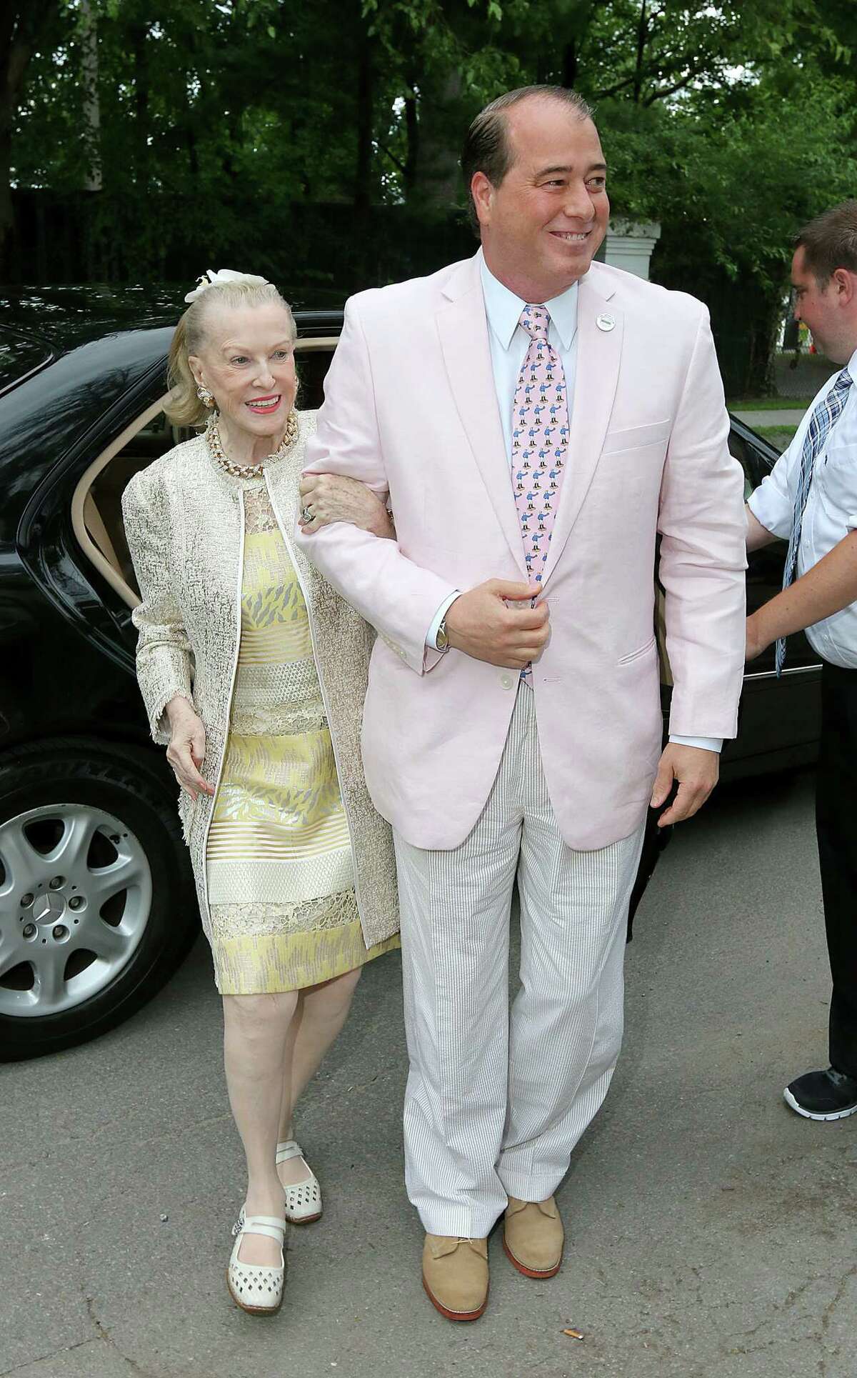 Saratoga Springs, NY - July 17, 2014 - (Photo by Joe Putrock/Special to the Times Union) - Philanthropist and prominent socialite Marylou Whitney(left) and her husband John Hendrickson(right) arrive at the 21st Annual Newton Plaza Siro's Cup to benefit the Center for Disability Services.