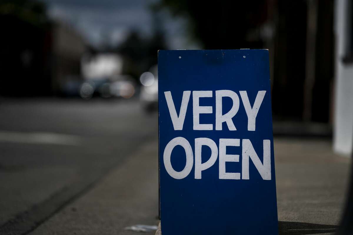 Signs of re opening businesses can be seen along Davis Street in downtown Santa Rosa, as California implements Phase 3 its state-wide economy opening plan during the coronavirus pandemic in Santa Rosa, California on Friday June 12, 2020.