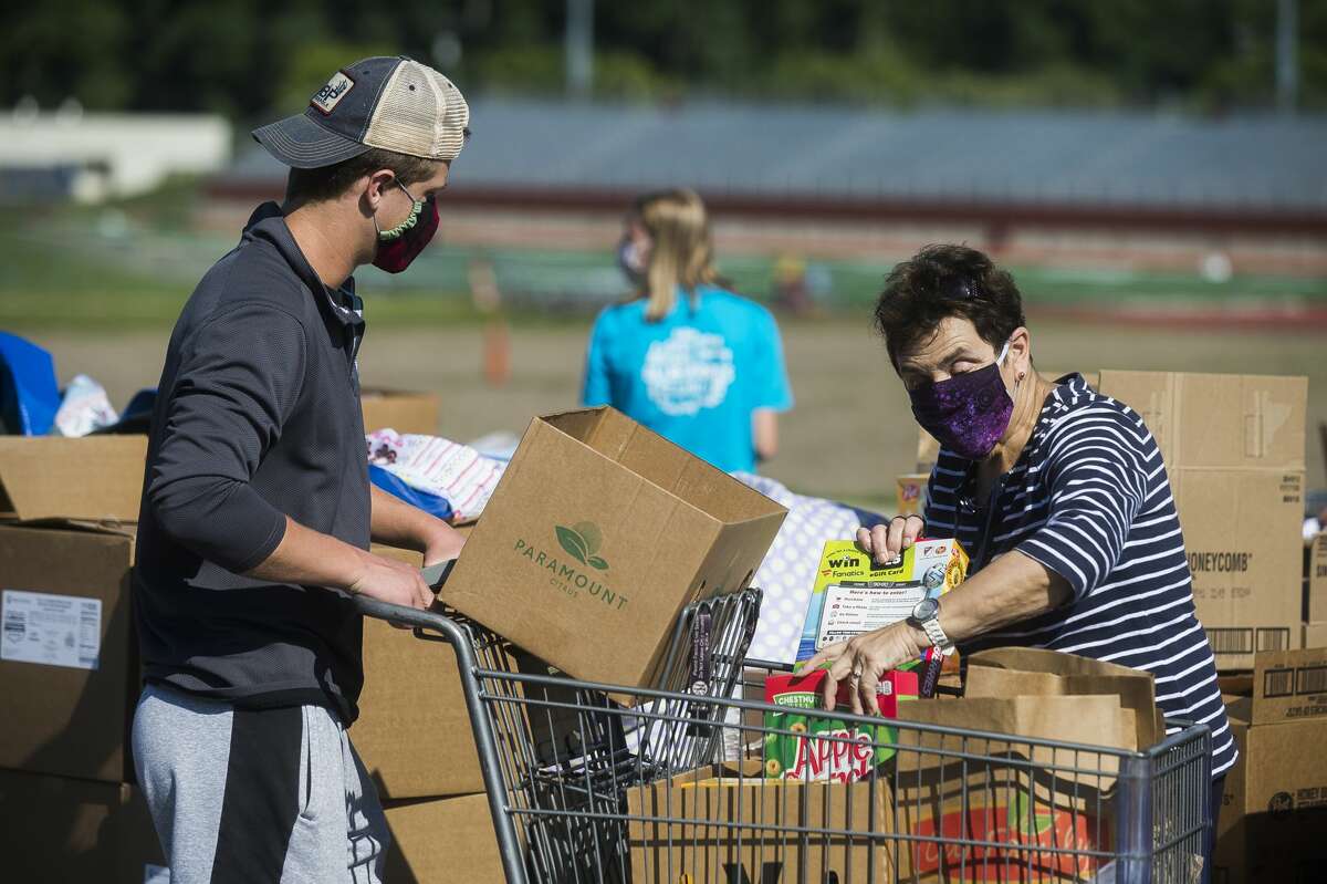 Photos Mobile food pantry assists hundreds at Midland High School