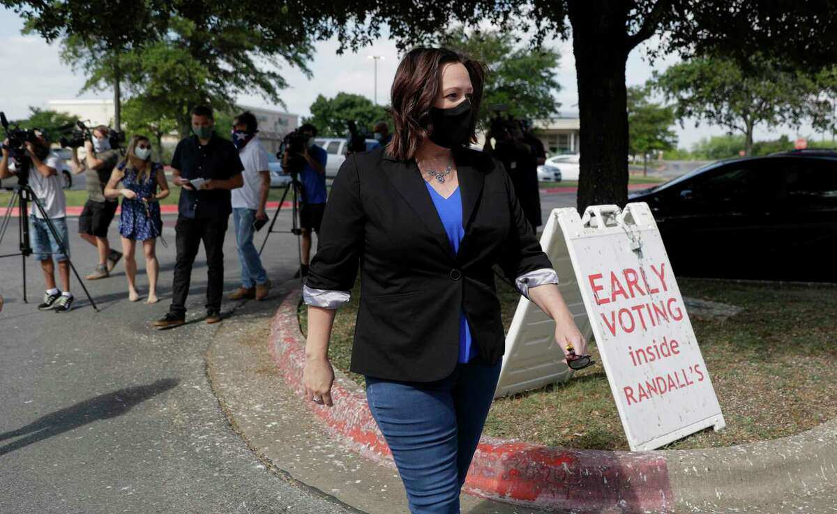 Democratic U.S. Senate candidate MJ Hegar heads to an early polling site after talking with the media, Thursday, July 9, 2020, in Austin, Texas. Hegar is in a runoff with State Sen. Royce West. (AP Photo/Eric Gay)