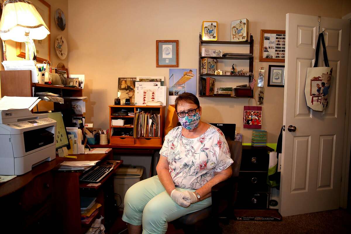 Donna Larsen poses for a portrait in her home work office on Tuesday, August 4, 2020, in Redding, Calif. Larsen's son Keith Doolin is a 47-year-old death row inmate at San Quentin State Prison. Larsen works on Keith's case every day and has 76 boxes of post-conviction evidence.