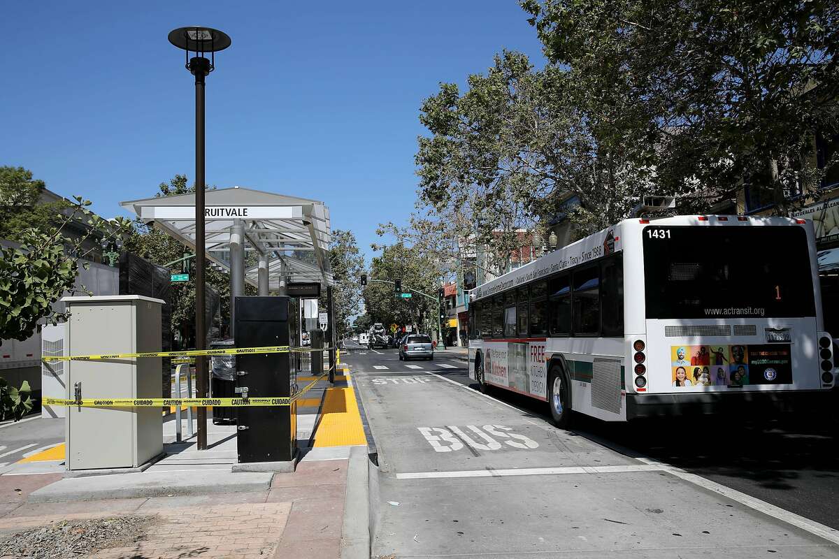 An AC Transit bus passes the new BART bus platform at 34th Ave. and International Blvd. (Fruitvale) on Friday, August 7, 2020, in Oakland, Calif. The bus line opens Sunday after decades of planning and debate, followed by a long construction period. It will connect Oakland's flatland neighborhoods to jobs in the downtown core.