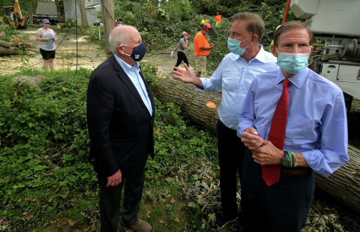 Governor Ned Lamont, center, and U.S Sen. Dick Blumenthal, right, visit with Westport first Selectman Jim Marpe to tour storm damage Friday in Westport.