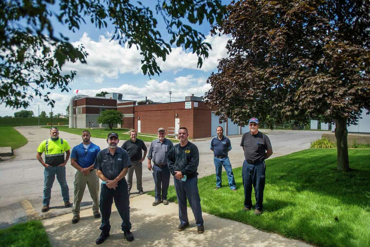 Staff of the Midland Wastewater Treatment Plant pose for a portrait Wednesday on the premises off of Bay City Road. (Katy Kildee/kkildee@mdn.net)