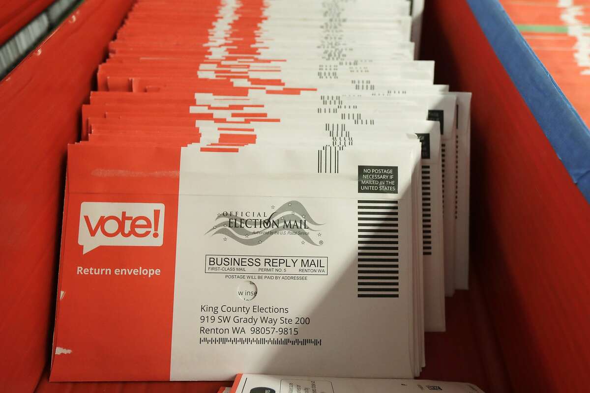 Vote-by-mail ballots are shown in a sorting tray, Wednesday, Aug. 5, 2020, at the King County Elections headquarters in Renton, Wash., south of Seattle. (AP Photo/Ted S. Warren)