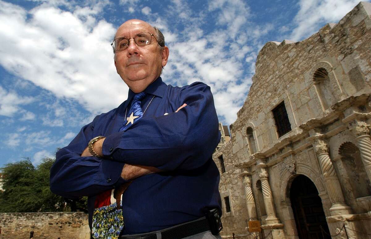 David Stewart poses in front of the Alamo church in 2002, when he began his seven-year stint as director of the state-owned Alamo grounds. Stewart, 82, died Tuesday at his home in Universal City.