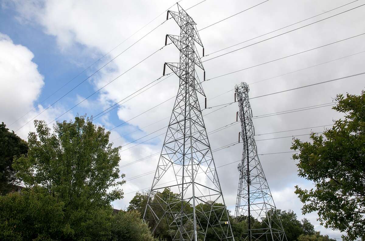 High-voltage power transmission lines owned by PG&E are seen stretched across a neighborhood near San Ramon Valley Boulevard in San Ramon, Calif. Friday, May 17, 2019.