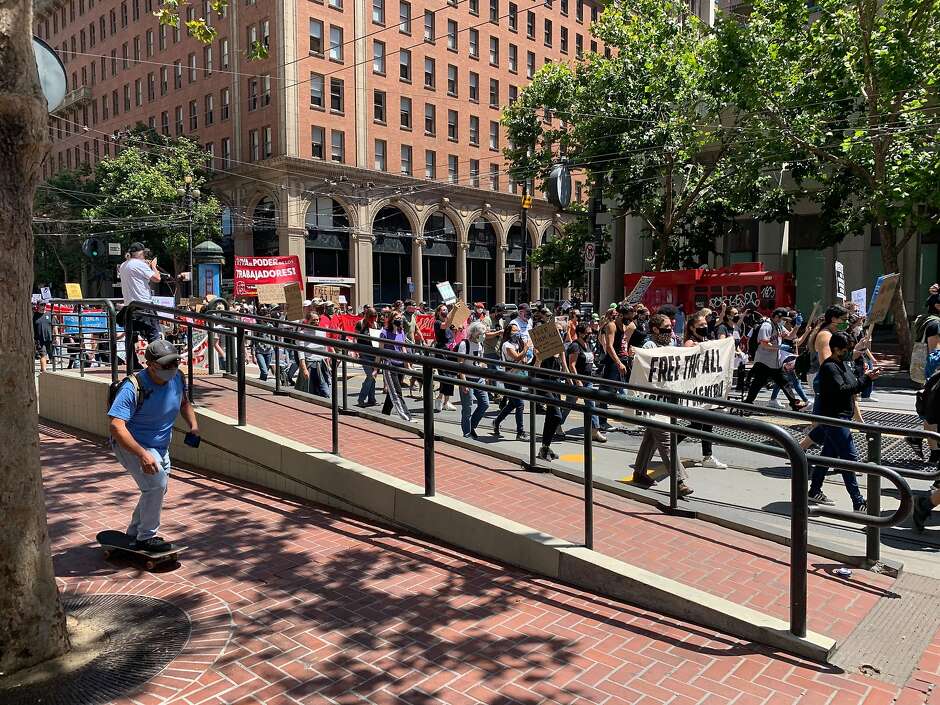 Protesters against U.S. Immigration and Customs Enforcement march down Market Street Saturday.