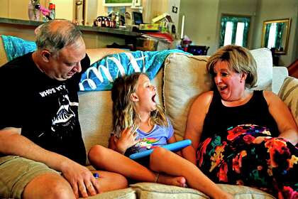 Amber Liddell Alwais and husband, Randy, are both lawyers. Amber said she couldn’t do her job and help their 8-year-old daughter, Rebecca, with remote learning at the same time. They plan to have Rebecca, who is showing them her missing tooth, return to her Hebrew language charter school when it opens for in-person classes on Sept. 8.