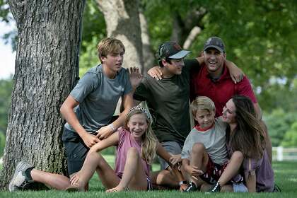 Courtney Bruce, her husband, Chris Bruce, pose with their children McCoy, 14, from left, Averley, 10, Hudson, 13, and Coleman, 7, at Main Plaza Park in Boerne. Courtney said she feels confident about sending her kids to in-person classes in the Boerne Independent School District, starting Aug. 12.