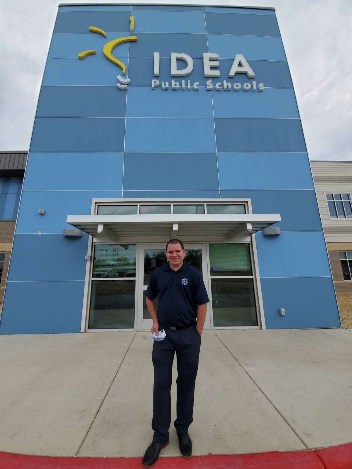 IDEA Converse College Prep Principal Joseph Lowe stands outside the new school’s front door. The campus opens Tuesday, Aug. 11, to 450 students in four grade levels.