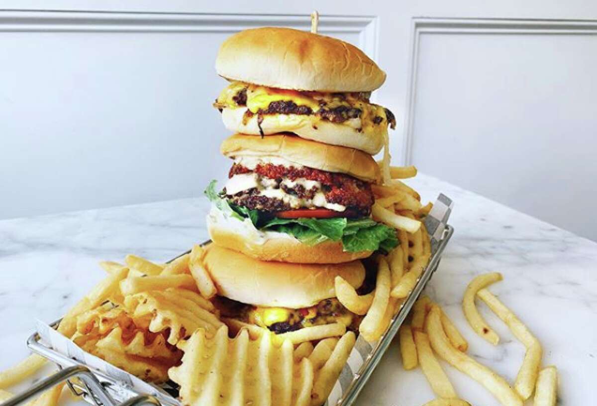 A stack of burgers from pop-up Smish Smash, located inside Oakland's Cookiebar Creamery.