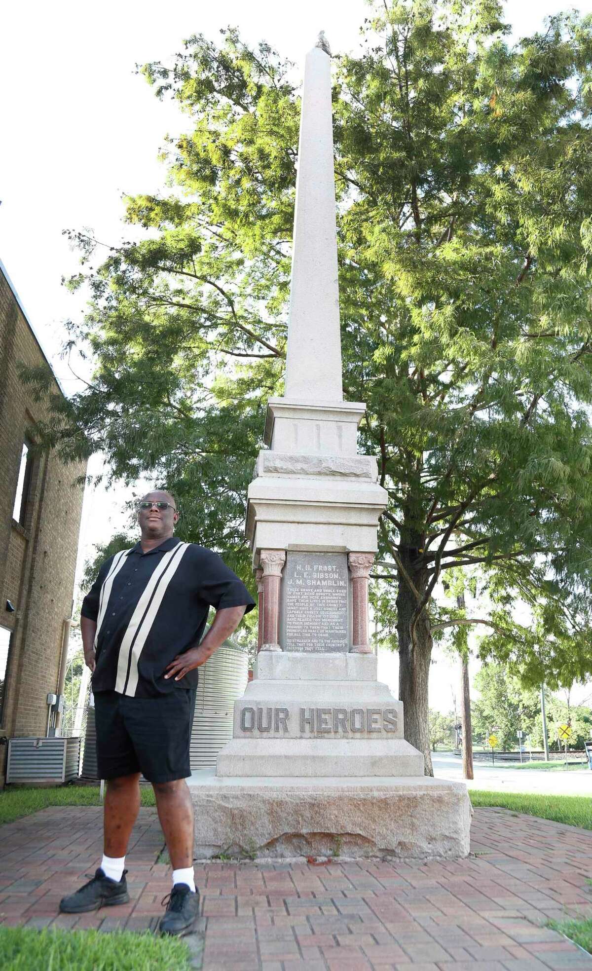 Tres Davis, a Richmond resident, is trying to assert ownership of a monument that sits near Richmond City Hall, Thursday, August 6, 2020, in Richmond. Over the summer, community members have asked for the monument to be removed, but right now it's fate is in limbo. Davis wants to take over ownership of the monument and move it to a museum. The monument pays homage to The Jaybirds, a white political group from the late 19th century. They permitted only white men to run for local political office.