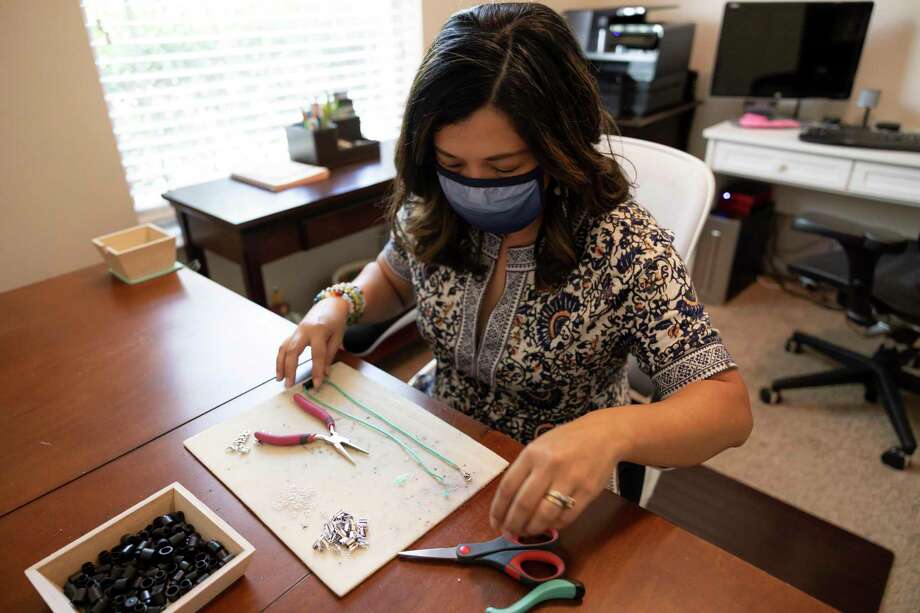 Cecille Wright creates a mask lanyards on Sunday in her home in Spring.. Wright focused advertisements in areas of the United States where masks are required to be worn. Photo: Gustavo Huerta, Houston Chronicle / Staff Photographer / Houston Chronicle © 2020