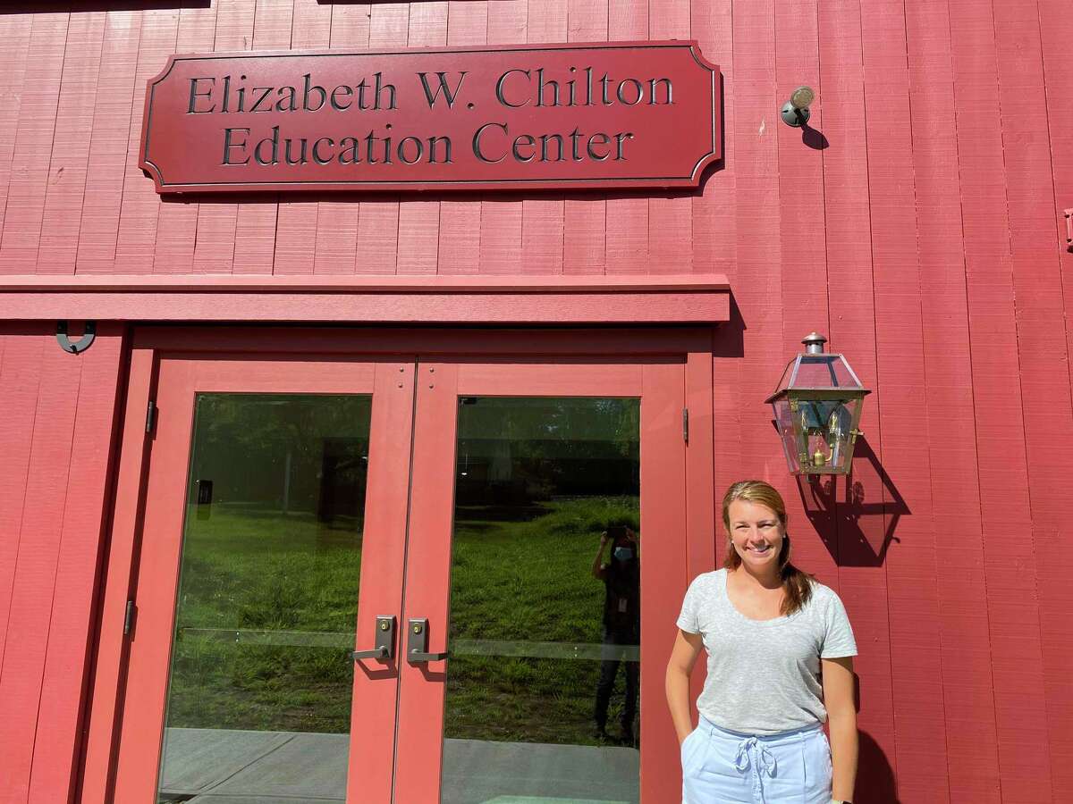 Executive director Lauren Swenson in front of the new Elizabeth W. Chilton Education Center.