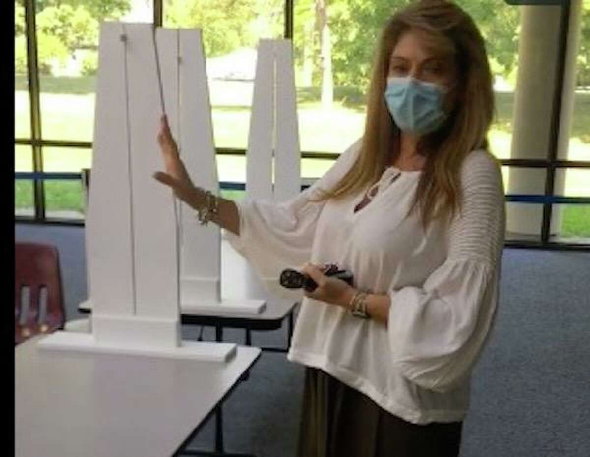 Registrar of Voters Annalisa Stravato (R) explains in a video how voters will show their ID to poll checkers when they come to cast ballots for the primary on Aug. 11, 2020.