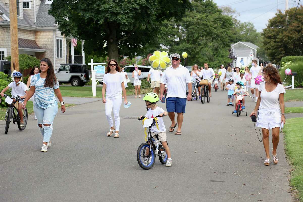 Most wore white in the parade for the celebration for the life of Deanna Herlihy on Saturday, Aug. 8, 2020, in Fairfield, Conn.