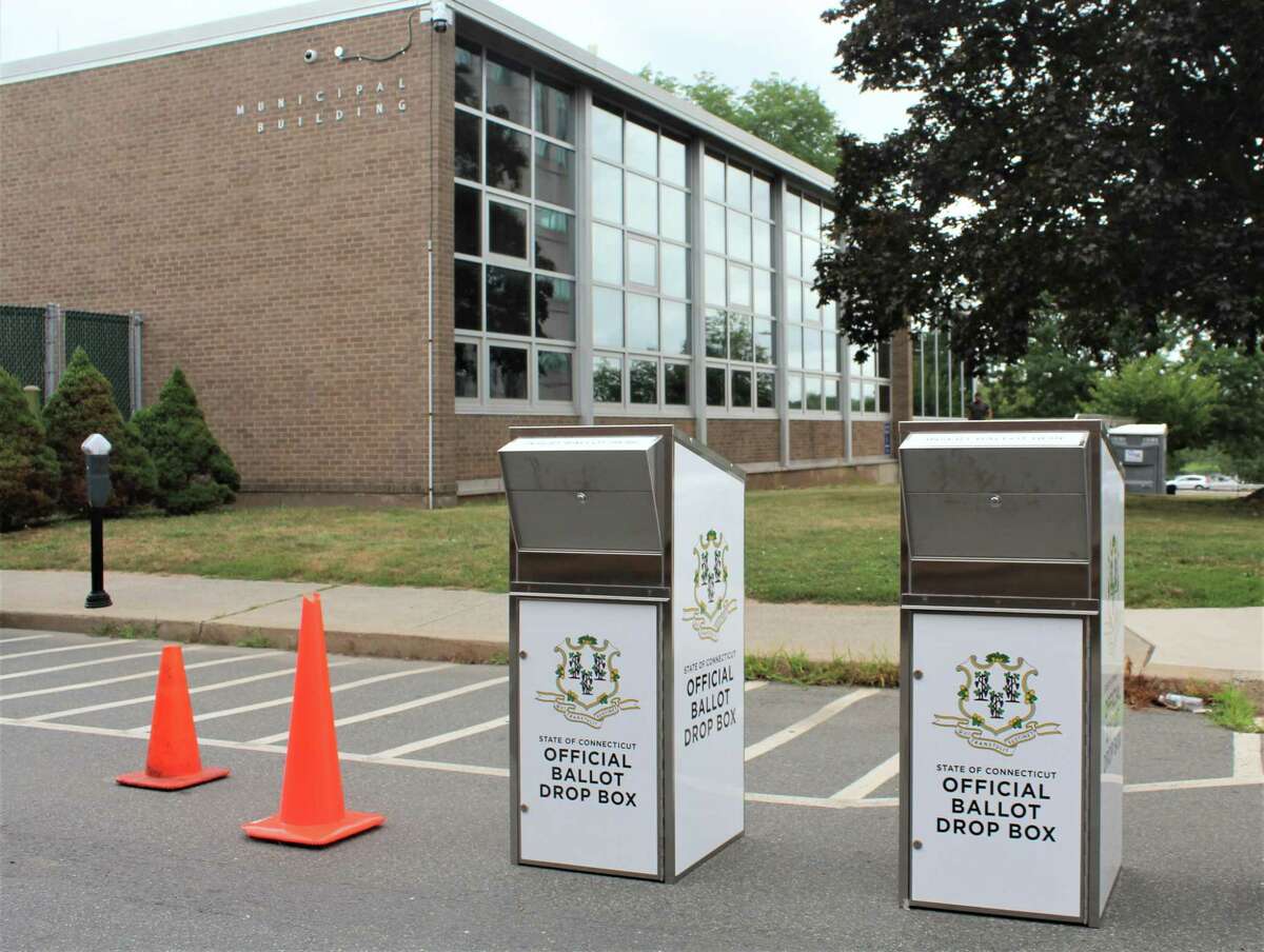 Two secure ballot boxes are positioned outside Middletown City Hall, off Court Street, so absentee voters can cast their votes for the upcoming election from their cars or on foot.
