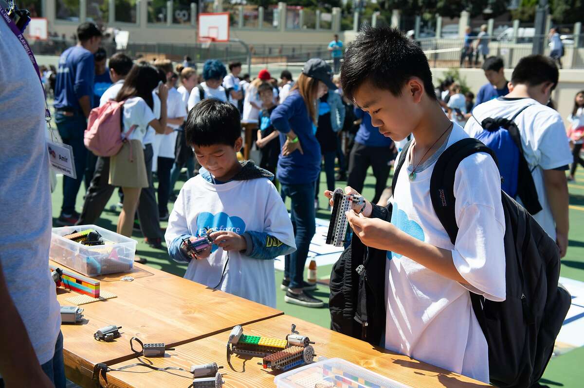 San Francisco students attend a science fair organized by Salesforce in 2019. The company is issuing $20 million in school grants around the country.