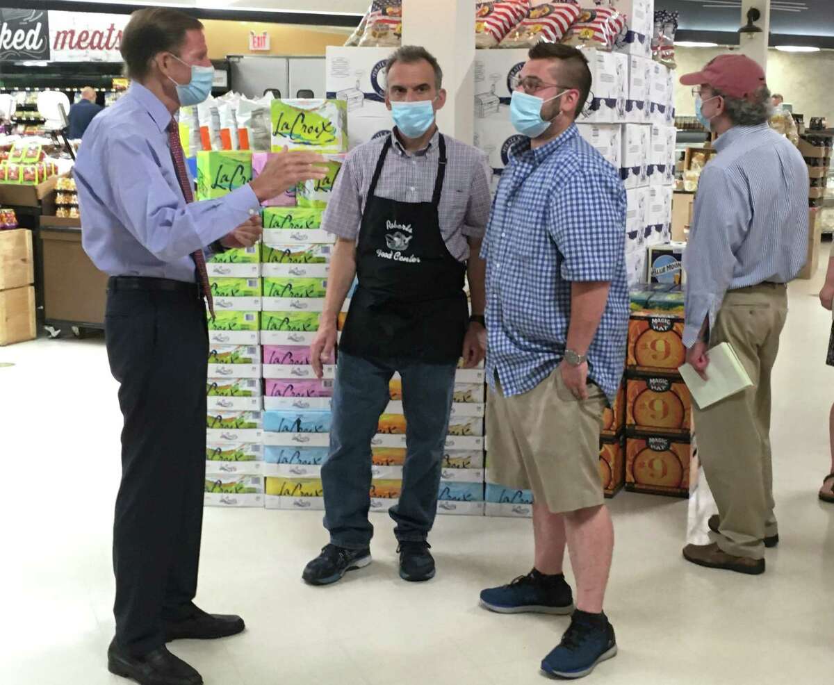U.S. Sen. Richard Blumenthal, D-Conn., left, tours Robert’s Food Center in Madison Aug. 10. Speaking with Blumenthal are co-owners Bob Fusco Jr., center, and Zach Fusco.