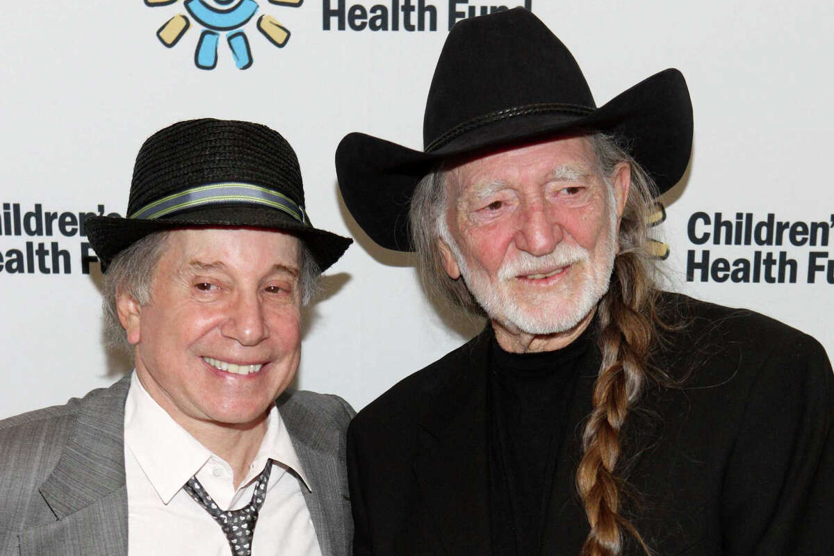 Recording artists Paul Simon and Willie Nelson attend the Children's Health Fund benefit at the Sheraton New York Hotel & Towers on May 27, 2009 in New York City.