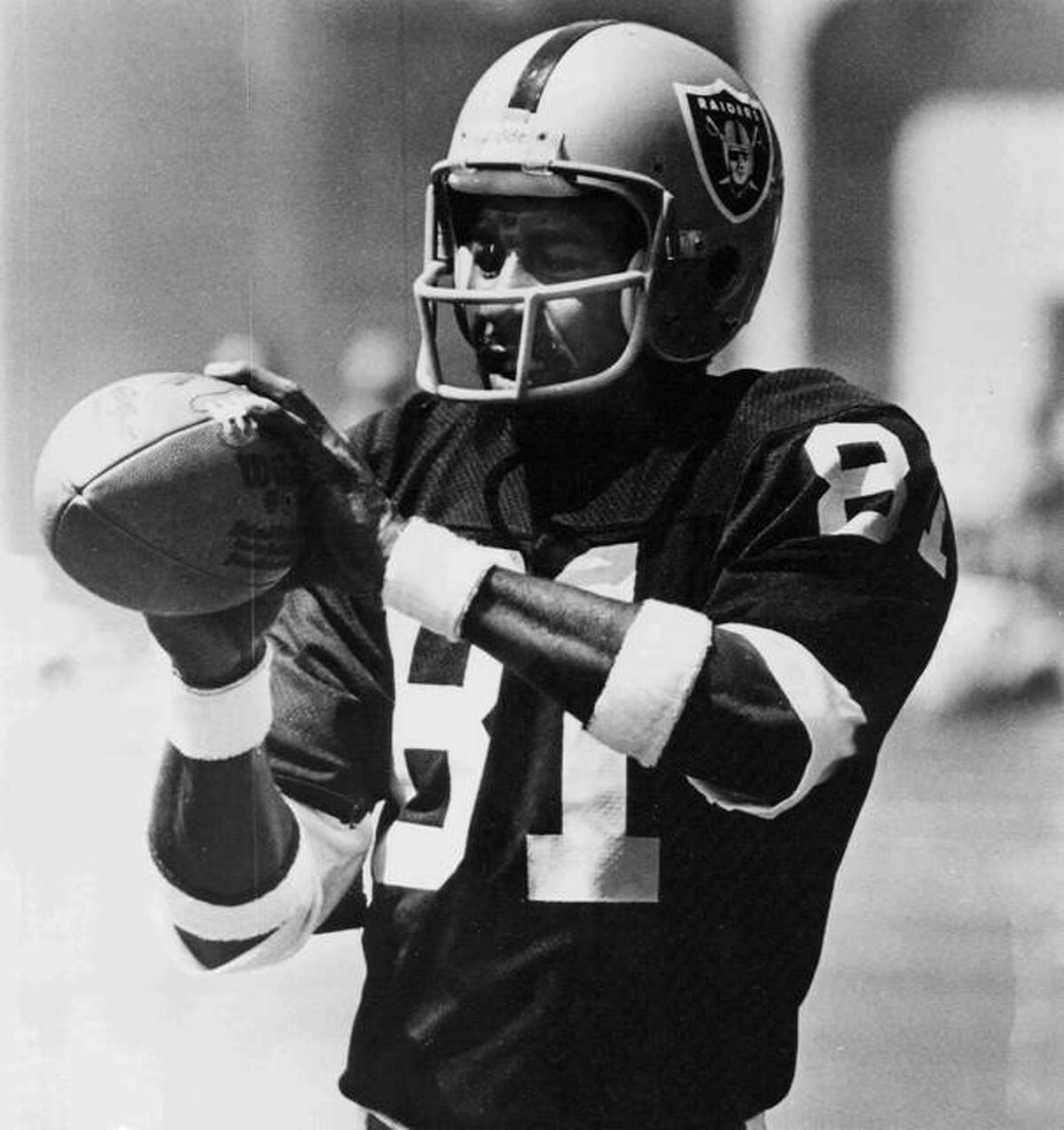 Edwardsville graduate Morris Bradshaw catches a pass for the Oakland Raiders. Bradshaw played for the Raiders from 1974 to 1981.