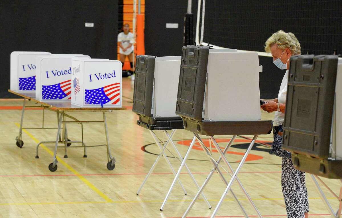 Jean Kulbieda of Stamford casts her vote in the last presidential primary prior to the November Elections, at the Polling Station for District #5 at Stamford High School on August 11, 2020 in Stamford, Connecticut.