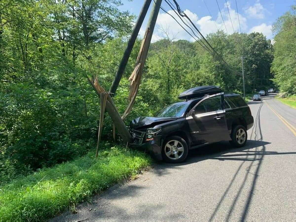 A utility pole was split during a crash on Sport Hill Road in Easton, Conn., on Tuesday, Aug. 11, 2020.